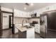 Modern kitchen featuring white cabinets, stainless steel appliances, and a center island at 8542 N 30Th Dr, Phoenix, AZ 85051