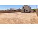 Large backyard with block wall and covered patio at 8577 S 253Rd Dr, Buckeye, AZ 85326