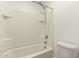 Bathroom with a shower and tub combo featuring white tiling at 8577 S 253Rd Dr, Buckeye, AZ 85326