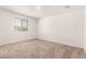 Inviting bedroom features a bright window, soft carpet, and neutral walls at 8577 S 253Rd Dr, Buckeye, AZ 85326