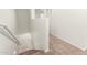 Staircase with carpeted steps, white walls, and a white railing at 8577 S 253Rd Dr, Buckeye, AZ 85326