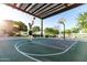 Active basketball court featuring a covered pavilion, providing a recreational space for residents and visitors at 8683 S 165Th Ave, Goodyear, AZ 85338