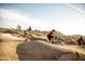 BMX bike park terrain featuring jumps and rollers, offering a great space for cycling enthusiasts at 8683 S 165Th Ave, Goodyear, AZ 85338
