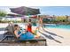 Resort-style community pool with shaded lounge areas and comfortable seating for relaxation and leisure at 8683 S 165Th Ave, Goodyear, AZ 85338