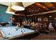 Active game room featuring a pool table, TV area, and seating, offering residents entertainment options at 8683 S 165Th Ave, Goodyear, AZ 85338