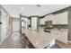 Bright and modern kitchen with granite countertops, stainless steel appliances, and large island at 8683 S 165Th Ave, Goodyear, AZ 85338