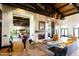 Elegant lobby with fireplace, comfortable seating, and chandelier, creating a welcoming and refined atmosphere at 8683 S 165Th Ave, Goodyear, AZ 85338