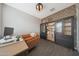 Well-designed office space with built-in shelving, wood floors, and comfortable seating at 8683 S 165Th Ave, Goodyear, AZ 85338