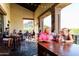 Outdoor restaurant patio with ample seating, offering picturesque views and a relaxed dining atmosphere at 8683 S 165Th Ave, Goodyear, AZ 85338