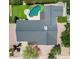 Aerial view of the backyard with an inground pool, lounge chairs, and putting green at 8732 E Sandalwood Dr, Scottsdale, AZ 85250