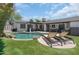 Backyard with an inviting pool, lounge chairs, and shade at 8732 E Sandalwood Dr, Scottsdale, AZ 85250