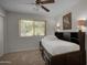 Bedroom with a twin daybed, open window, and neutral carpet at 8732 E Sandalwood Dr, Scottsdale, AZ 85250
