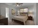 Bright bedroom boasts natural light, carpeted floors, and a connecting ensuite bathroom at 8732 E Sandalwood Dr, Scottsdale, AZ 85250