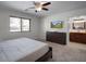 Bedroom features a window with natural light, large dresser, and an attached ensuite bathroom at 8732 E Sandalwood Dr, Scottsdale, AZ 85250