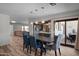 Open-concept dining area with modern lighting, a spacious table, and convenient access to the outdoor patio at 8732 E Sandalwood Dr, Scottsdale, AZ 85250