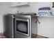 Modern laundry room features new appliances and storage at 8732 E Sandalwood Dr, Scottsdale, AZ 85250
