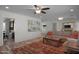 Comfortable living room with a large sectional couch and open layout to other living spaces at 8732 E Sandalwood Dr, Scottsdale, AZ 85250
