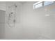Modern shower features white subway tile, a rainfall showerhead, and a built-in bench at 8732 E Sandalwood Dr, Scottsdale, AZ 85250