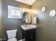 Charming powder room features a stylish vanity, modern fixtures, and elegant lighting, creating a welcoming and functional space at 9005 W Villa Chula St, Peoria, AZ 85383