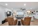 Bright living room featuring a plush sectional, leather chairs, and wood floors at 9005 W Villa Chula St, Peoria, AZ 85383