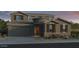 Charming two-story home with a two-car garage and desert landscaping at 10205 W Weldon Ave, Avondale, AZ 85392