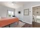 Bedroom with hardwood floors, neutral walls, and a view of the backyard at 10723 N 118Th Way, Scottsdale, AZ 85259