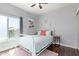 Bedroom with hardwood floors, natural light, and a comfortable white bed at 10723 N 118Th Way, Scottsdale, AZ 85259