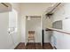 Walk-in closet with built-in shelves and wooden floors, providing ample storage at 10723 N 118Th Way, Scottsdale, AZ 85259