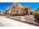 Beautiful home with desert landscaping, stone walkway, and inviting front entrance at 10723 N 118Th Way, Scottsdale, AZ 85259