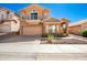 Inviting two-story home with a balcony, desert landscaping, and a two-car garage at 10723 N 118Th Way, Scottsdale, AZ 85259