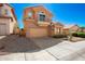 Charming two-story home with a balcony and two-car garage on a sunny day at 10723 N 118Th Way, Scottsdale, AZ 85259