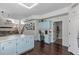 Spacious kitchen with light blue cabinets, a long countertop, and an open design leading to other living areas at 10723 N 118Th Way, Scottsdale, AZ 85259