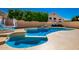 Pool with built in spa and rock waterfall, and canopy daybed offers relaxation and entertainment at 10723 N 118Th Way, Scottsdale, AZ 85259