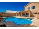 Backyard pool and spa, with a rock waterfall feature, is perfect for relaxing or entertaining at 10723 N 118Th Way, Scottsdale, AZ 85259