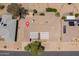 Overhead view of the property showing the layout of the home and solar panels on neighboring homes at 12831 W Maplewood Dr, Sun City West, AZ 85375