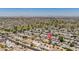 An aerial shot showcases the neighborhood, proximity to the golf course, and mountain views at 12831 W Maplewood Dr, Sun City West, AZ 85375