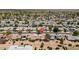 Birds-eye view of a neighborhood showcasing the mature landscaping and desert-style yards at 12831 W Maplewood Dr, Sun City West, AZ 85375