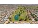 Beautiful aerial shot of a golf course community showcasing the lush green course and pond at 12831 W Maplewood Dr, Sun City West, AZ 85375