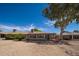 Backyard with low-maintenance gravel landscaping and mature trees for a private outdoor space at 12831 W Maplewood Dr, Sun City West, AZ 85375