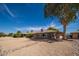 Well maintained backyard featuring gravel landscaping and mature trees offering shade and privacy at 12831 W Maplewood Dr, Sun City West, AZ 85375