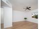 Bedroom features wood floors, a ceiling fan, and a window at 12831 W Maplewood Dr, Sun City West, AZ 85375