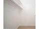 Walk-in closet features hanging racks at 12831 W Maplewood Dr, Sun City West, AZ 85375