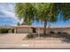 Beautiful single-Gathering home with a two-car garage, desert landscaping, and a privacy wall in front yard at 12831 W Maplewood Dr, Sun City West, AZ 85375