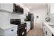 Modern kitchen featuring stainless steel appliances and white subway tile backsplash at 12831 W Maplewood Dr, Sun City West, AZ 85375