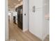 Modern kitchen with white cabinets, dark hardware, and stainless steel appliances at 12831 W Maplewood Dr, Sun City West, AZ 85375