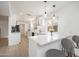 Modern kitchen featuring white cabinets, a breakfast bar, and stainless-steel appliances at 12831 W Maplewood Dr, Sun City West, AZ 85375