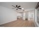 Spacious living room has wood floors, ceiling fan, and closet at 12831 W Maplewood Dr, Sun City West, AZ 85375