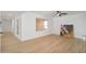 Living room features wood floors, a ceiling fan, and natural lighting at 12831 W Maplewood Dr, Sun City West, AZ 85375
