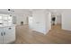 Spacious living room features wood floors and ceiling fan at 12831 W Maplewood Dr, Sun City West, AZ 85375