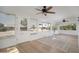 Bright sun room offering serene views and featuring tiled floors and a ceiling fan at 12831 W Maplewood Dr, Sun City West, AZ 85375